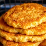 A stack of golden Tyson chicken patty air fryer basket.